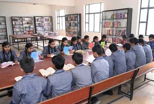 Students reading together in the school library